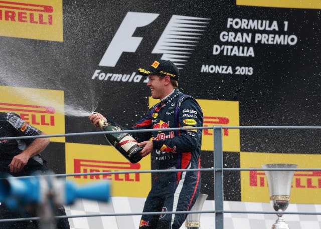 Red Bull’s Sebastian Vettel sprays champagne on the podium after winning the 2013 Italian Grand Prix