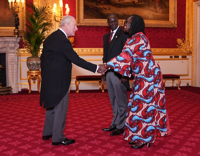Maurice Makoloo, High Commissioner for Kenya, accompanied by Christine Asoma, during an audience with the King