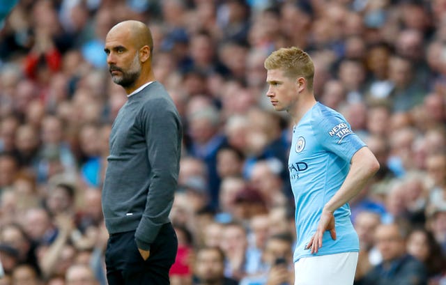 Manchester City manager Pep Guardiola, left, has been without Kevin De Bruyne for much of the season
