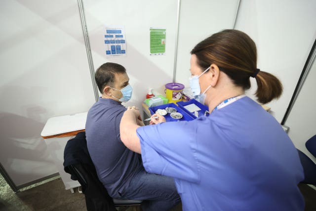 Gary Davidson, 55, from Lisbane in Co Down, was the first to receive the AstraZeneca vaccine at the newly opened Covid-19 vaccination centre in the SSE Arena, Belfast