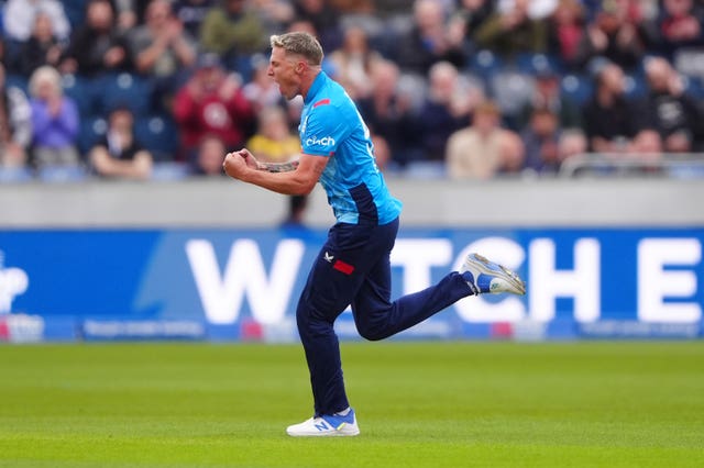 Brydon Carse celebrates a wicket