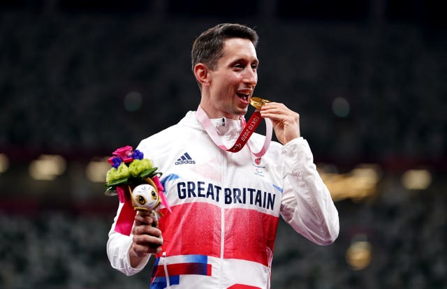 Jonathan Broom-Edwards celebrates with his gold medal after winning the men's high jump - T64