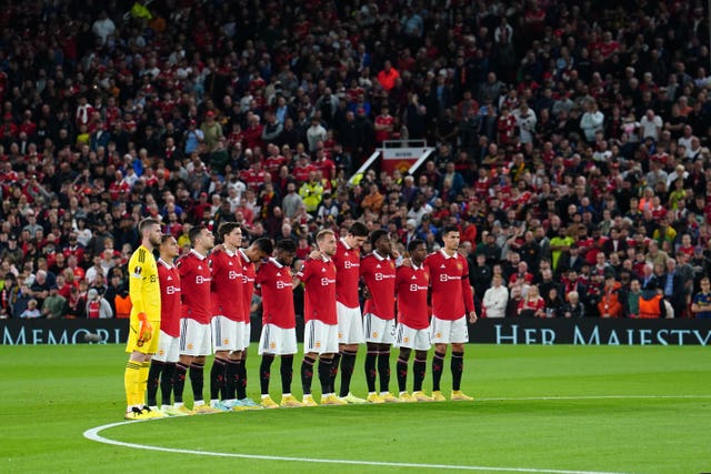Manchester United players take part in a minute's silence prior to their Uefa Europa League Group E match at Old Trafford on Thursday evening