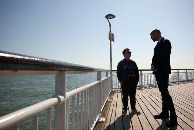 The Prince of Wales with Theo from Homewards’ National Co-Production Group during a visit to see Homewards’ groundbreaking youth homelessness work at Bournemouth Pier in Dorset