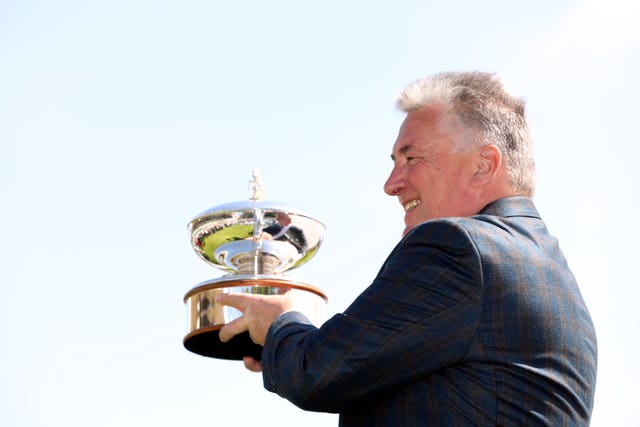 Paul Nicholls receives his trophy at Sandown 