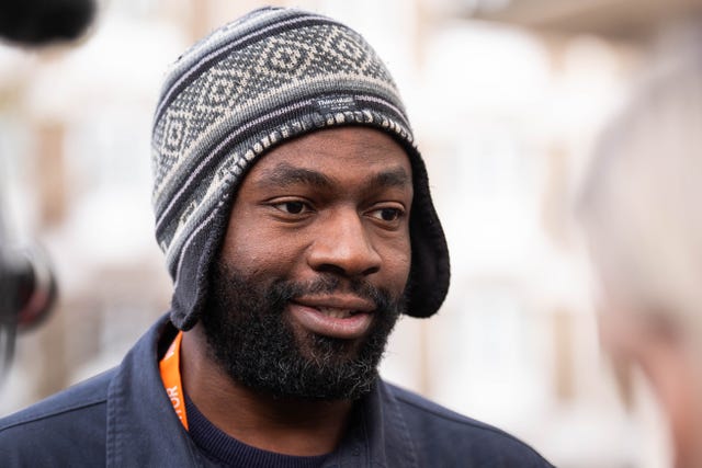 Head shot of a bearded man wearing a hat 