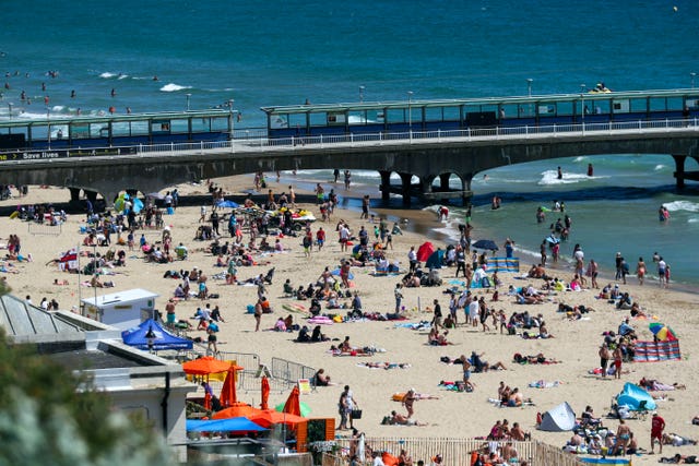 People on the beach at Bournemouth as the hot weather continues
