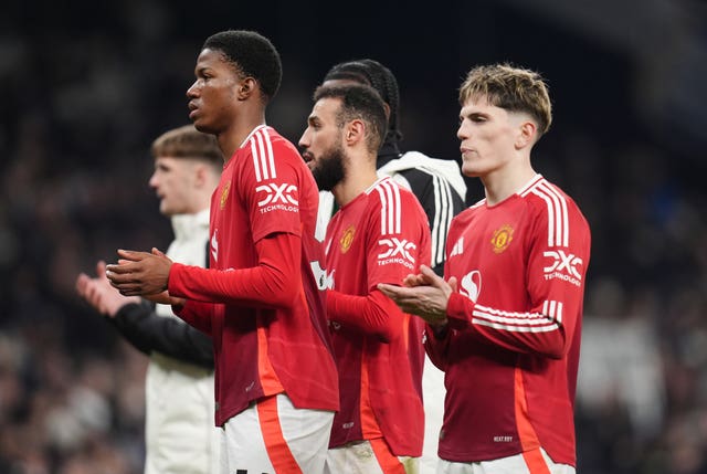 Manchester United players applaud their fans