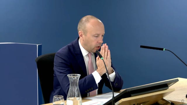 Matt Hancock with his hands clasped together, giving evidence to the Covid inquiry