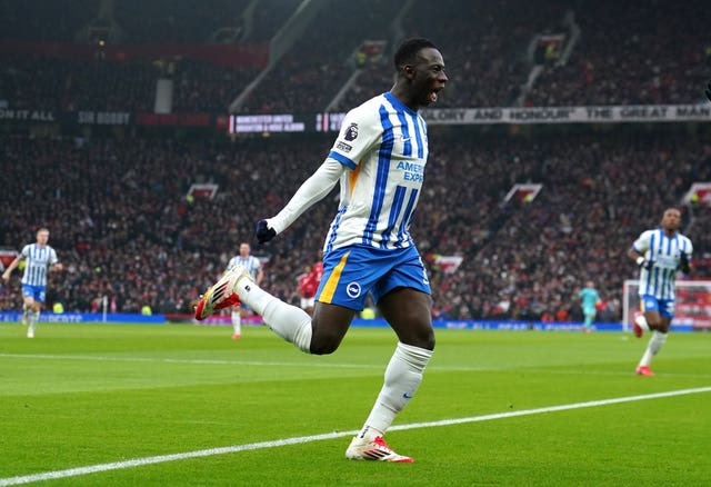 Yankuba Minteh celebrates scoring the opener at Old Trafford