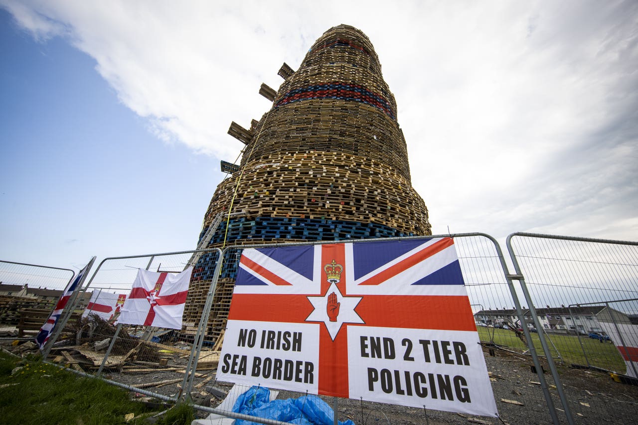 Why are huge bonfires lit across Northern Ireland on Eleventh Night