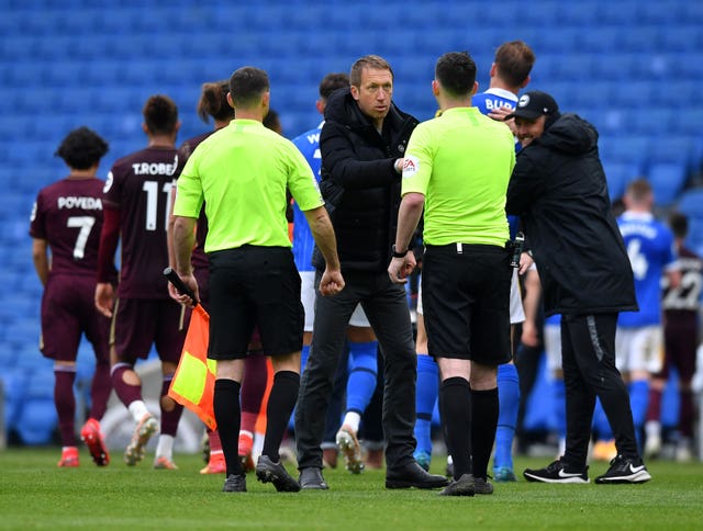 Graham Potter shakes hands with the officials 