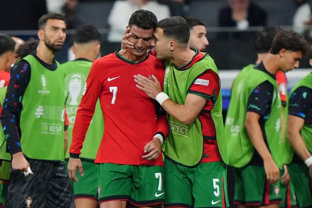 Portugal’s Cristiano Ronaldo is consoled by Diogo Dalot at Euro 2024
