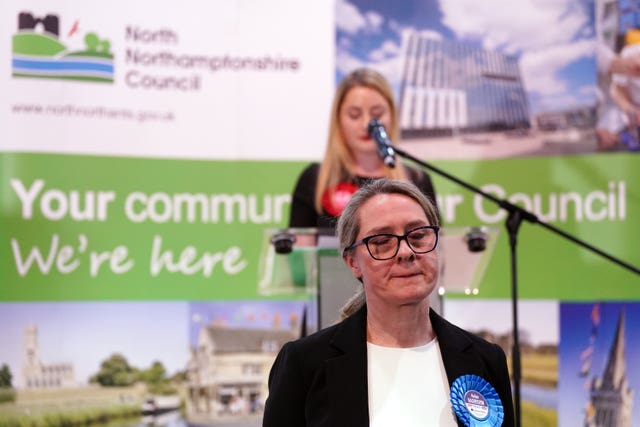 Conservative Party candidate Helen Harrison listens as the Labour Party's Gen Kitchen give her victory speech 
