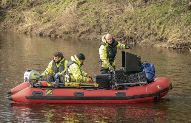 Workers from Specialist Group International on the River Wyre, near St Michael’s on Wyre, Lancashire, on Monday 