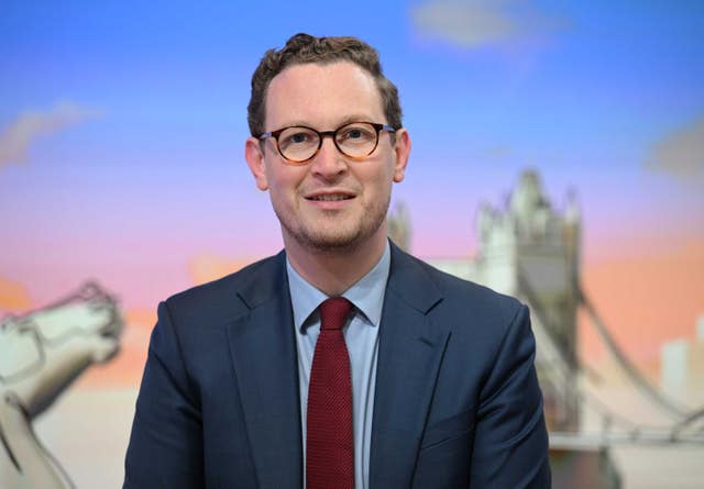 Darren Jones smiling while seated in a TV studio