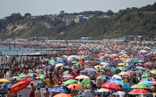 Crowds gather on the beach in Bournemouth on Thursday