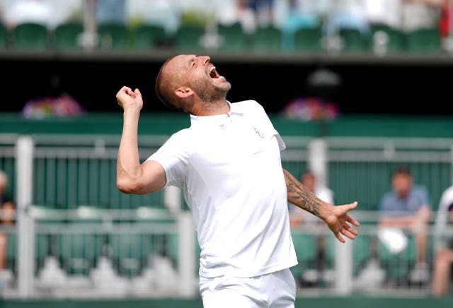 Dan Evans celebrates beating Jay Clarke