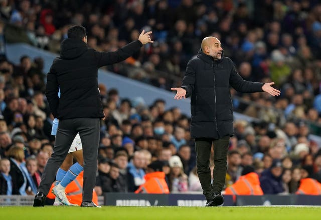 Arsenal manager Mikel Arteta, left, and Manchester City boss Pep Guardiola
