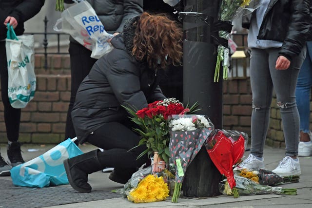 Flowers are laid at the site of the incident (Kirsty O'Connor/PA)