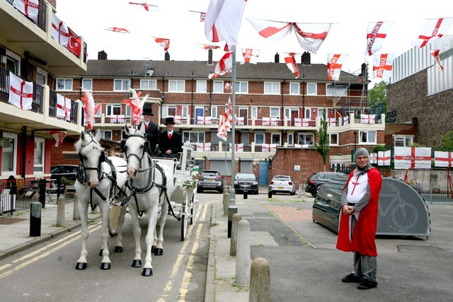 Alan Putman, in costume and a horse drawn carriage, on the Kirby Estate in Bermondsey