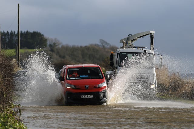 Vehicles pass through a flooded area of the Portaferry Road in Newtownards. Co Down 