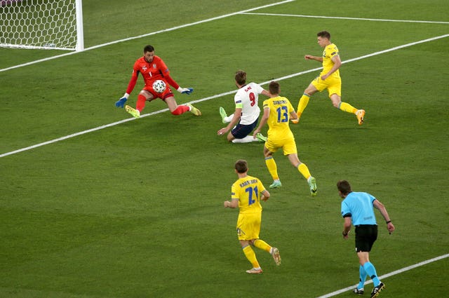 Harry Kane, centre, slides in to give England an early lead