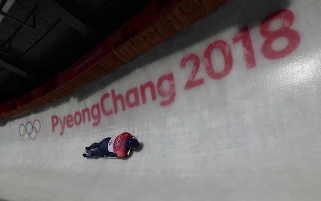 Great Britain’s Dom Parsons slides his way towards a bronze medal in the men's skeleton 