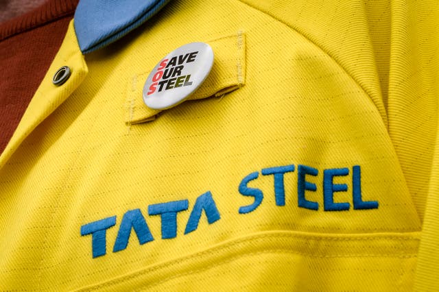 A worker wears a Save Our Steel badge on his Tata jacket