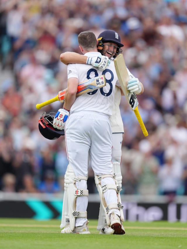England’s Harry Brook celebrates his century with Joe Root at the Oval