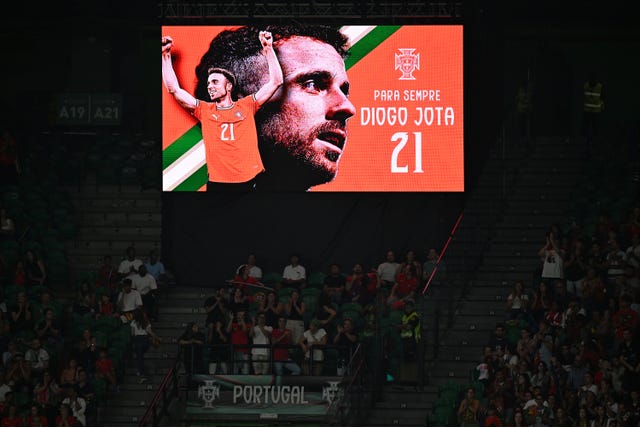 Tributes are made to former Portugal and Liverpool player Diogo Jota during the twenty first minute