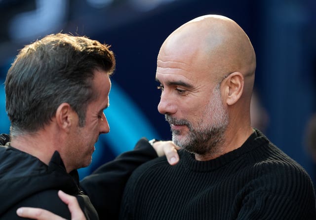 Fulham manager Marco Silva (left) greets Manchester City manager Pep Guardiola 