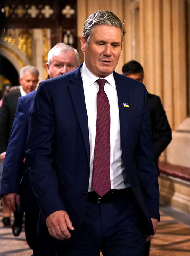 The leader of the Labour Party Sir Keir Starmer walks through the Central Lobby at the Palace of Westminster during the State Opening of Parliament in the House of Lords