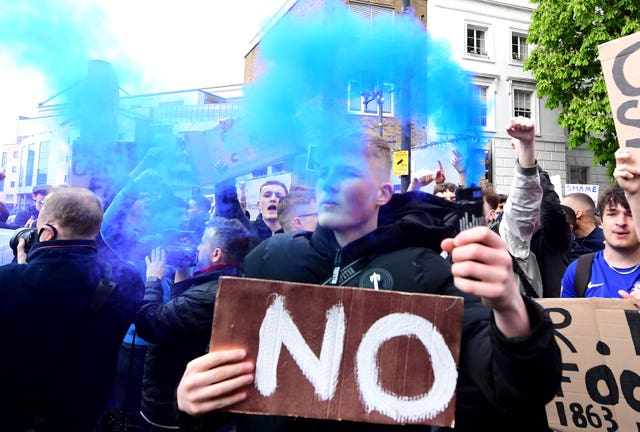 Fans protest against Chelsea's involvement in the new European Super League outside Stamford Bridge