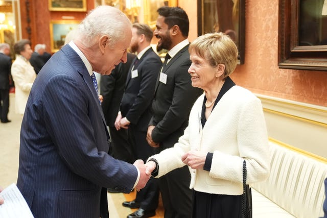 King shaking hands with Nellie Hill