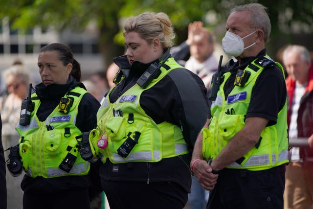 Police officers journed the one minute's silence in Plymouth city centre (Ben Birchall/PA)