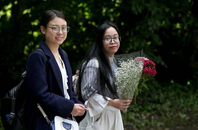 Students and film fans Yunyao Li, 23 (left) and Qiong dan Xu, 24, from Glasgow, at the main entrance to Wardhill Castle