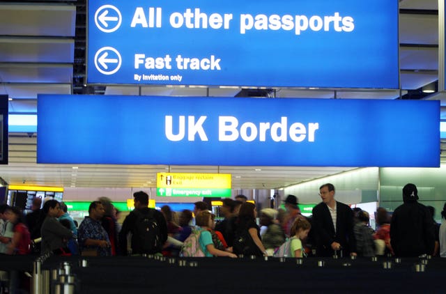 Passengers going through the UK Border at Terminal 2 of Heathrow Airport