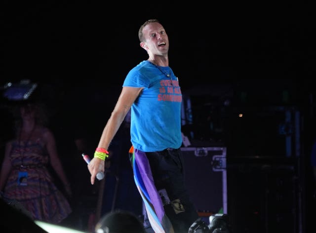 Coldplay's Chris Martin performing on the Pyramid Stage at the Glastonbury Festival