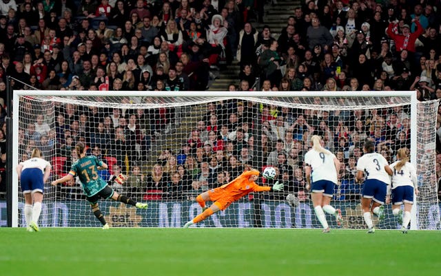 Sara Dabritz, second left, scores Germany’s fourth goal from a penalty