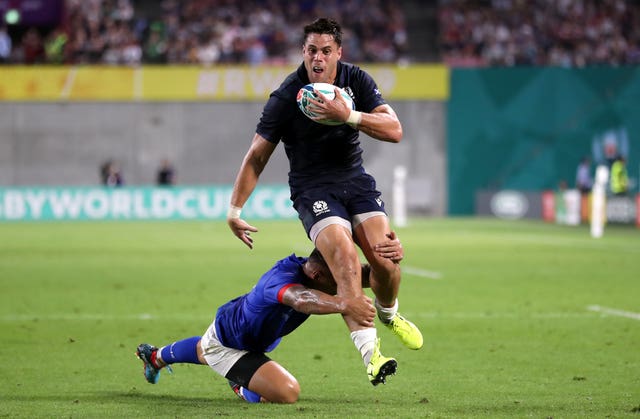 Sean Maitland breaks a tackle to score Scotland's first try