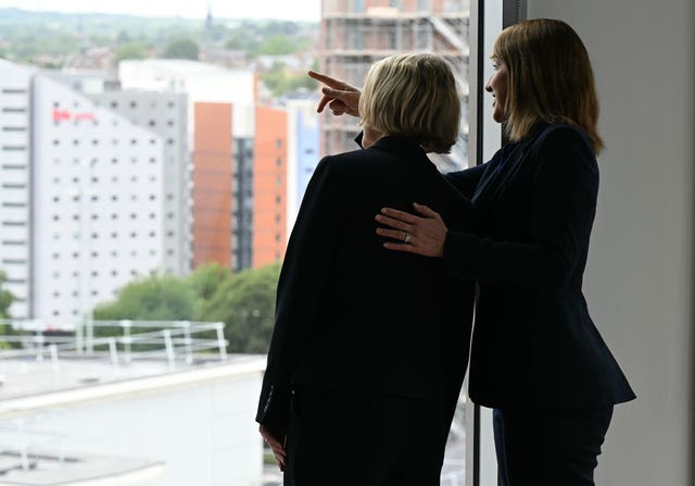 Chancellor Rachel Reeves talks with Economic Secretary to the Treasury Emma Reynolds as they look from a window before a roundtable discussion with top finance executives at Lloyds Banking Group’s offices in Leeds, West Yorkshire, as she announces a package of financial services reforms 
