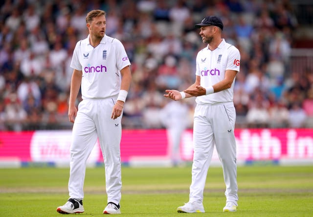 Ollie Robinson (left) and James Anderson in action for England