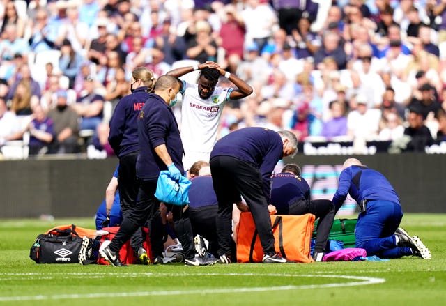 Ashley Westwood receives treatment on the pitch 