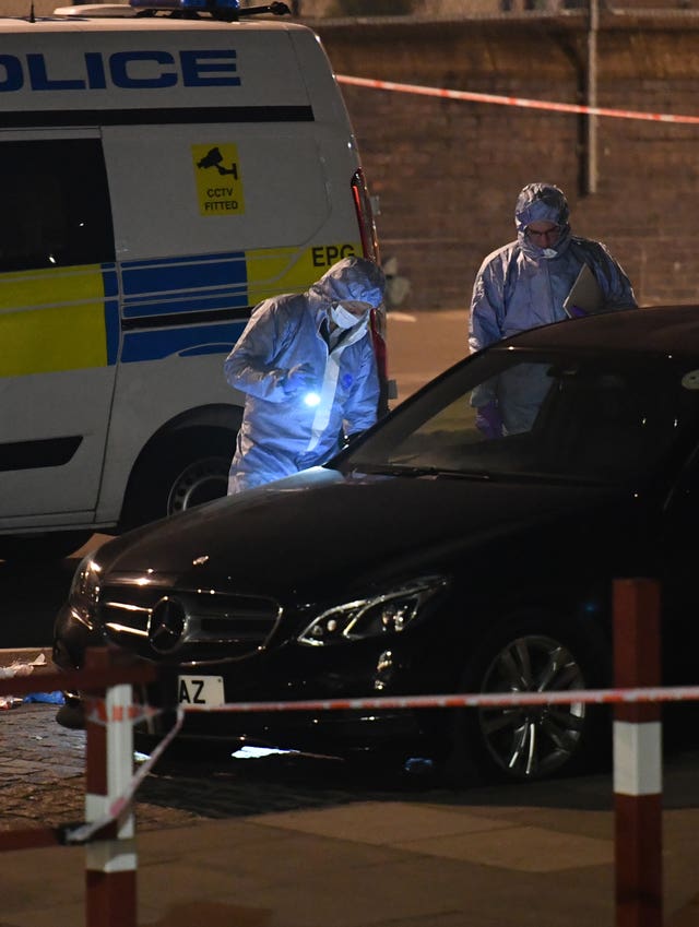 Police activity near the Grafton Road junction with Vicars Road after the fatal stabbing of a man in his 20s (John Stillwell/PA Wire)