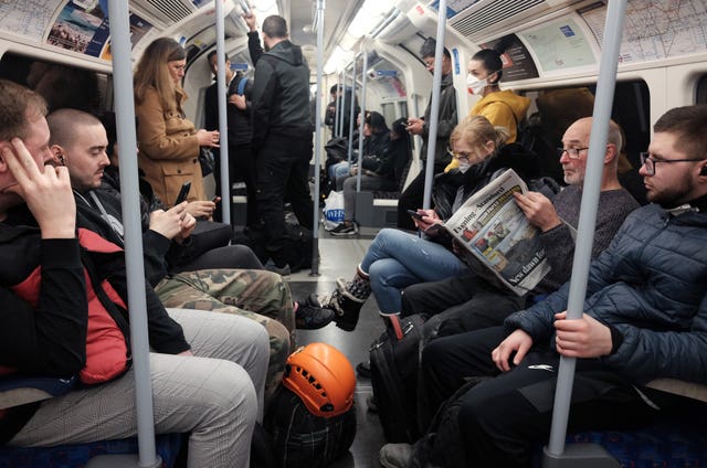 A busy Jubilee line eastbound train carriage, the day after Prime Minister Boris Johnson put the UK in lockdown 