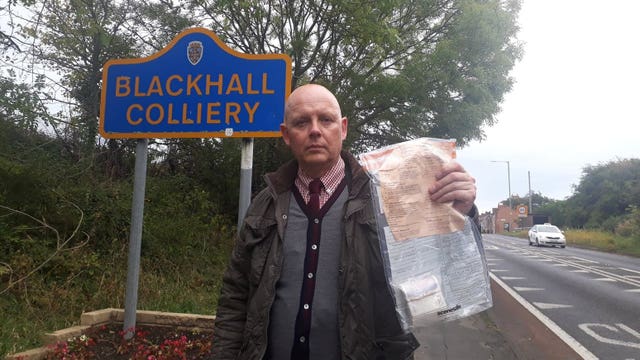 Detective Constable John Forster with one of the bundles 