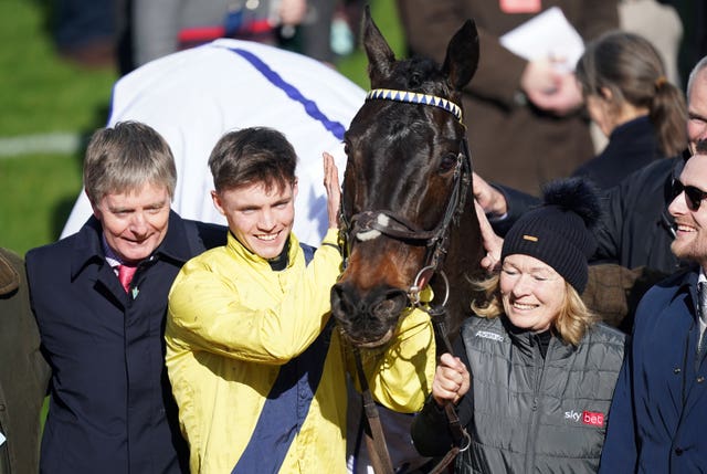 Michael O’Sullivan celebrates winning the Sky Bet Supreme Novices’ Hurdle with Marine Nationale, alongside owner and trainer Barry Connell (left) on day one of the Cheltenham Festival 