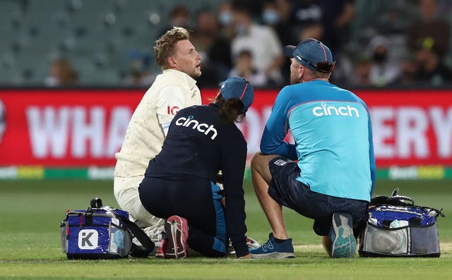 Joe Root (left) after being struck