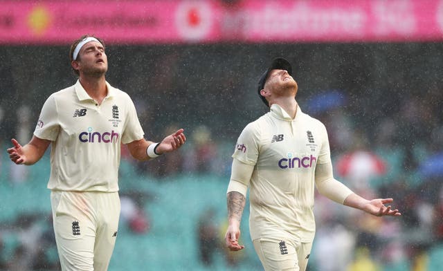 Stuart Broad (Left) and Ben Stokes (right) look to skies for answers as the rain falls in Sydney.